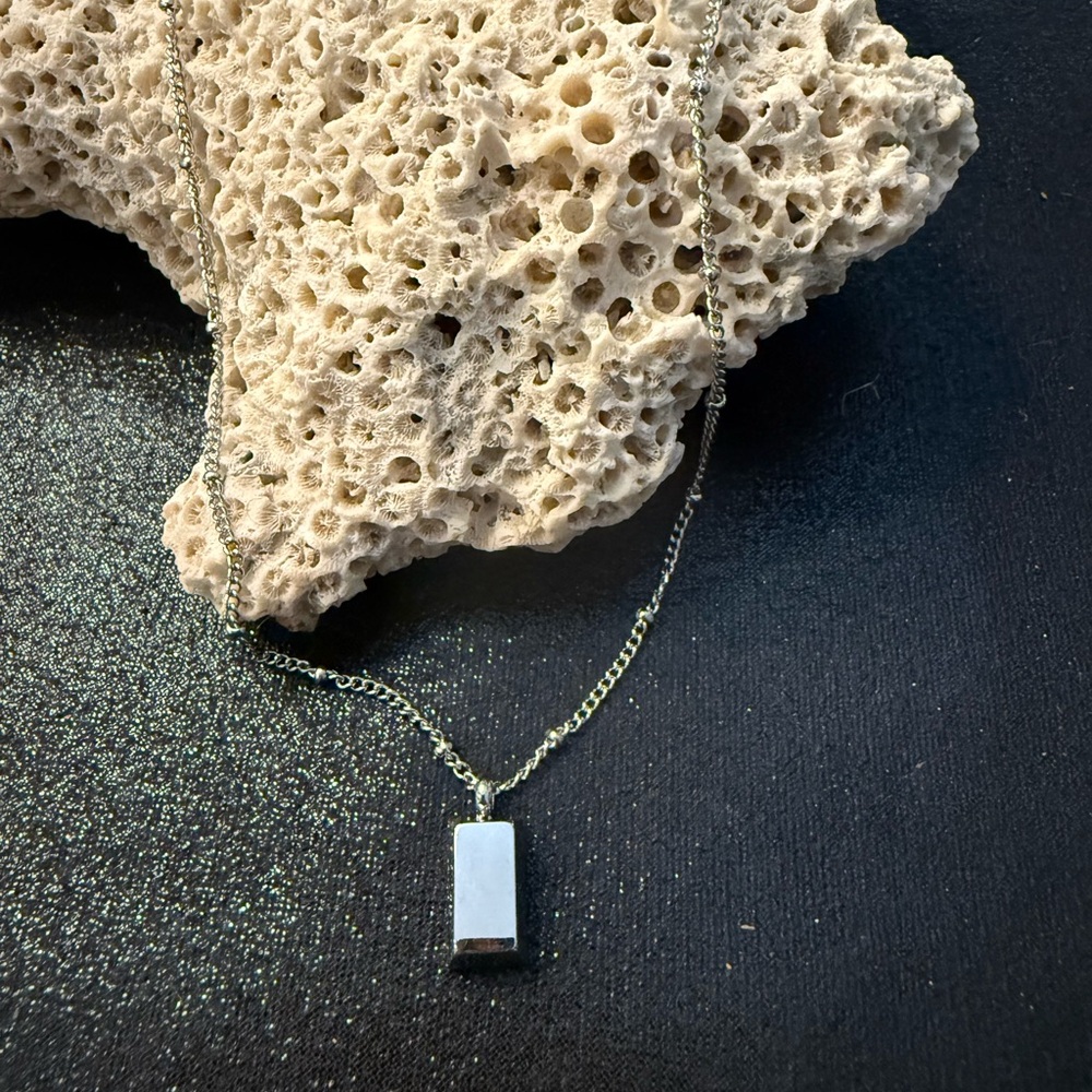 Stainless steel silver tone bar necklace with 18” adjustable to 20” chain.